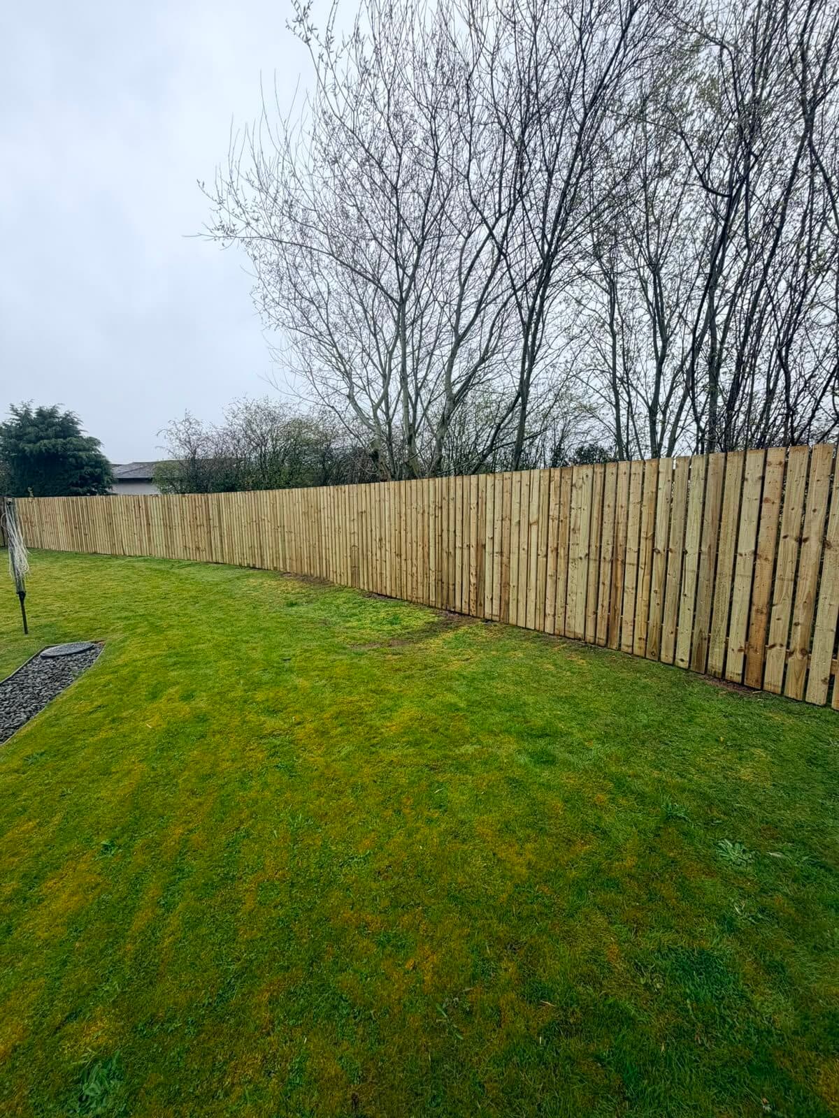 Timber field gate fitted into a wire stock fence line