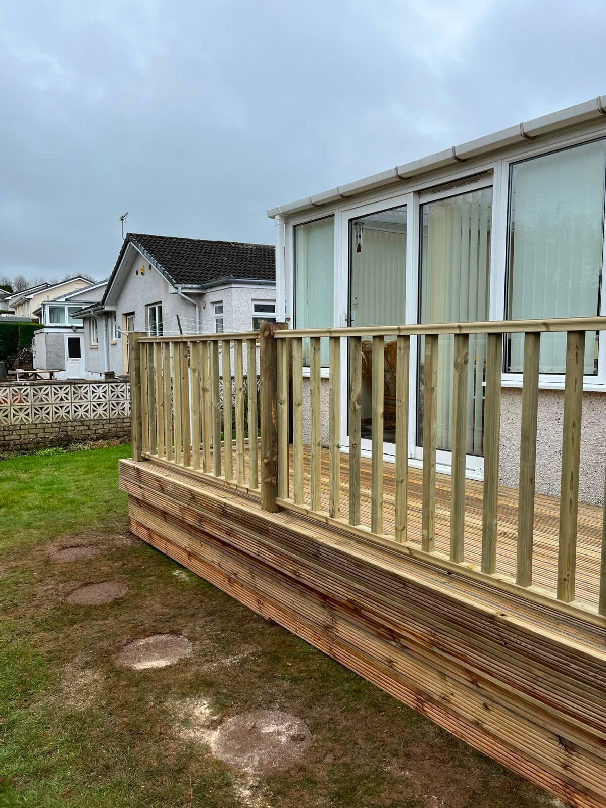 Composite decking with a glass balustrade