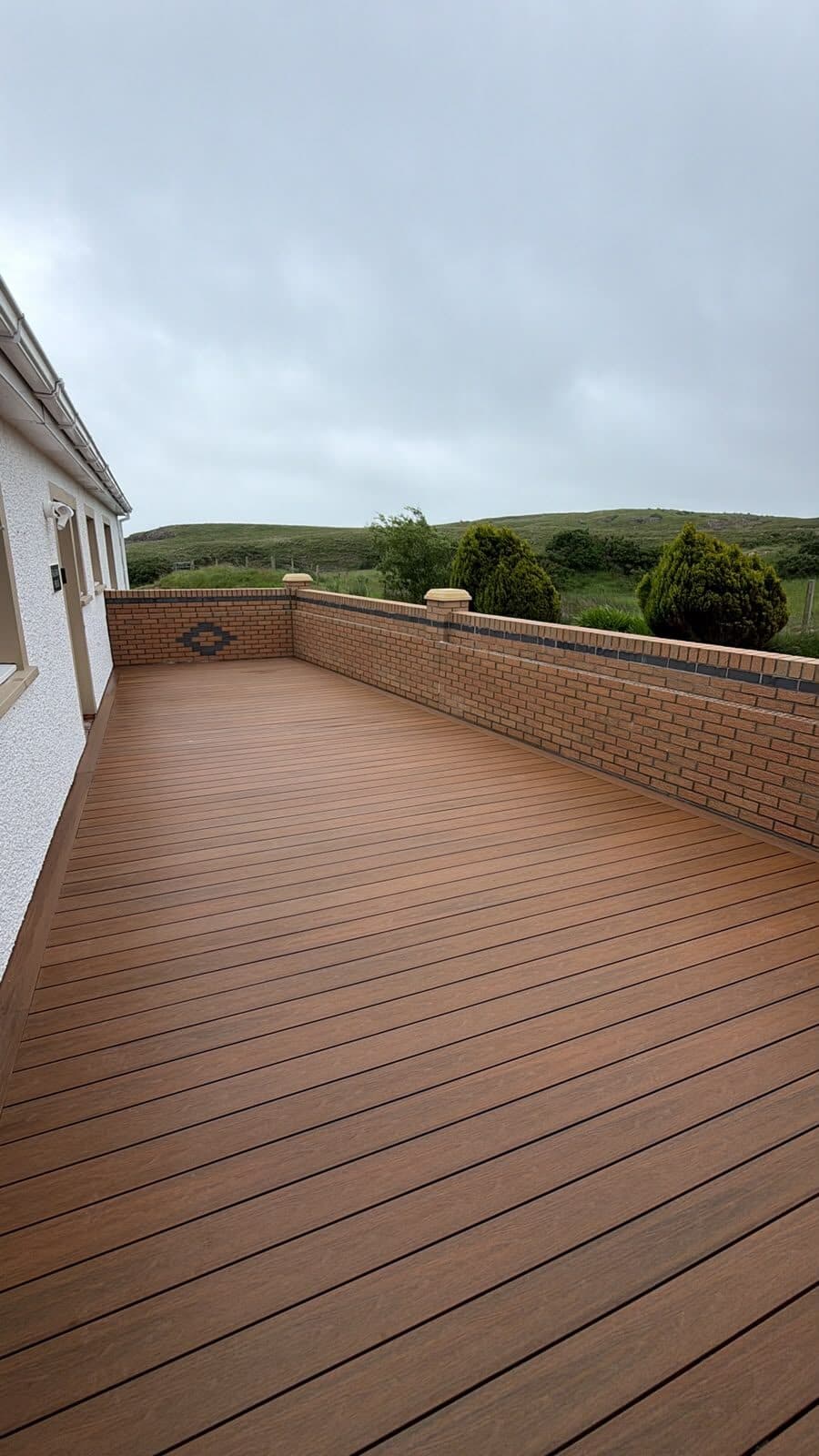 Timber fencing beside a gravelled driveway