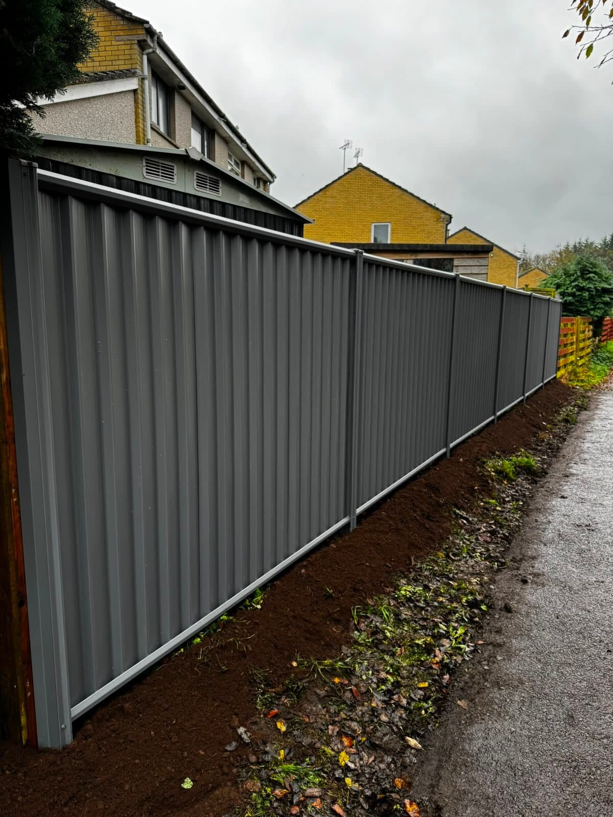 Close-board timber fence around a garden