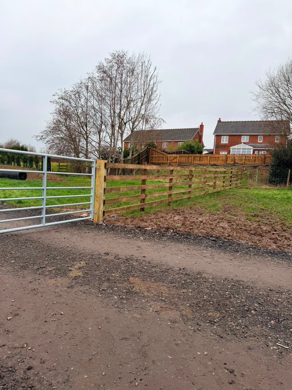 Close-board timber fence along a residential road
