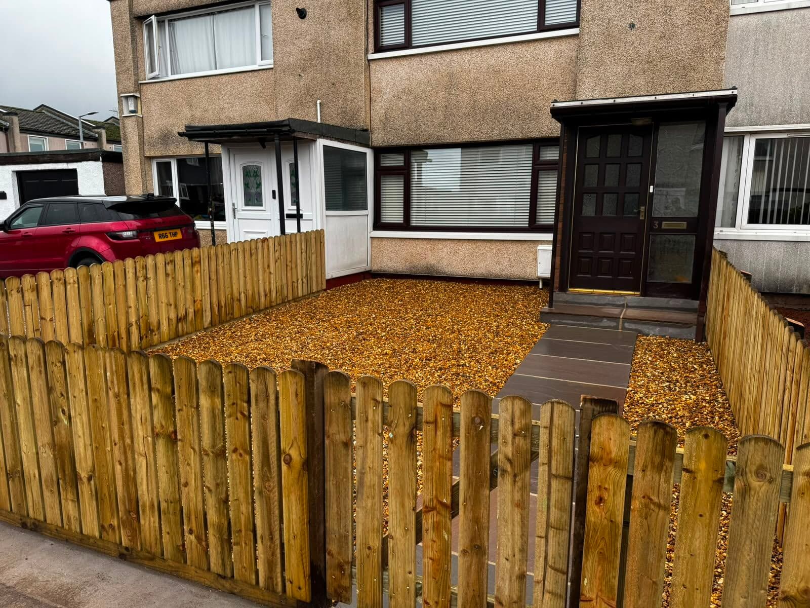 Timber picket-style fence around a front garden