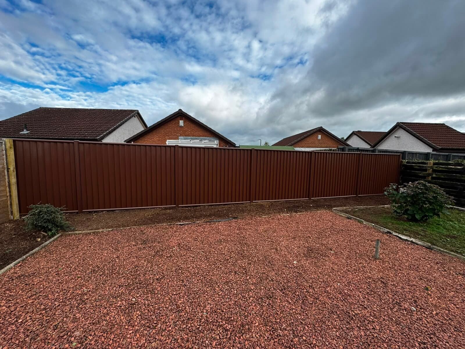 Close-board timber fencing along a garden boundary