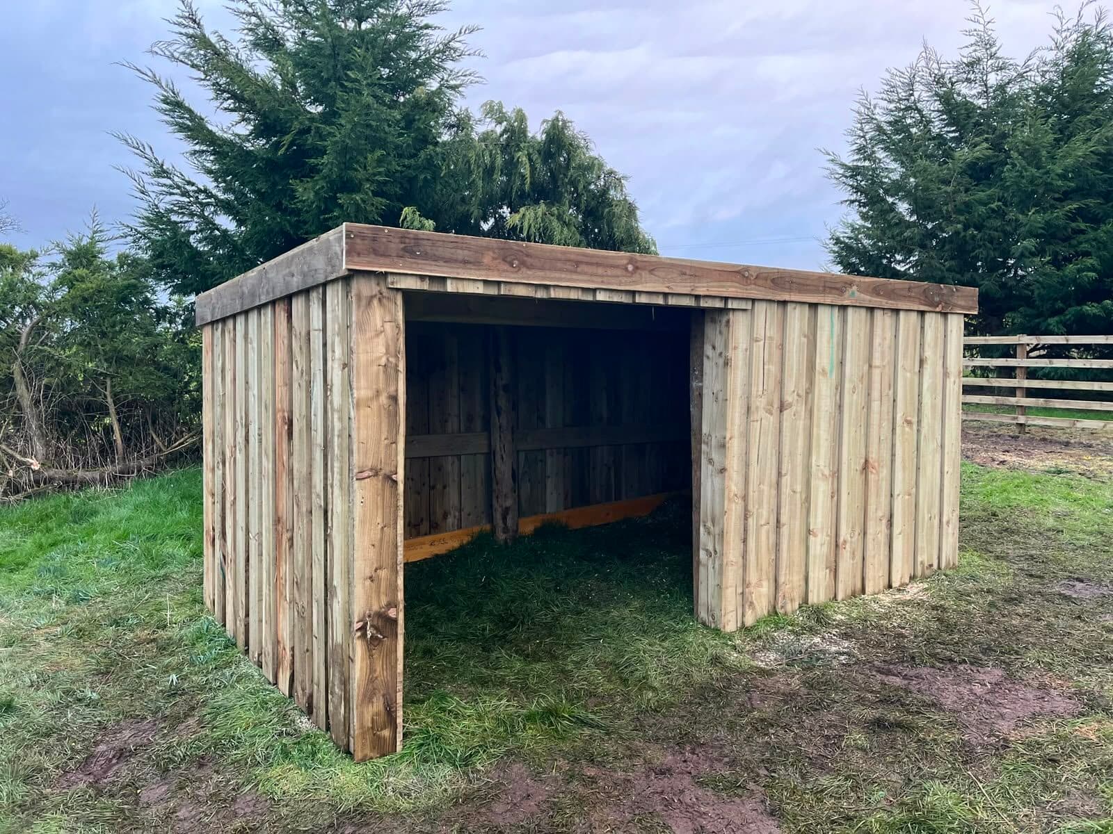 Open-fronted timber shelter built for outdoor storage